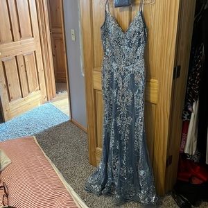 Smoke blue glitter prom dress with boustier type top with sheer ribbing.